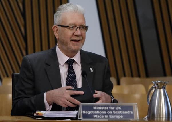 SNP minister Mike Russell has said the EU Withdrawal Bill will let the UK government undermine devolution. Picture: Andrew Cowan/PA