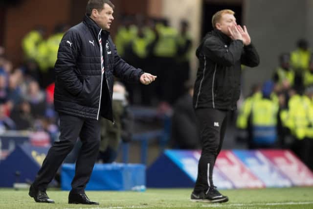 Graeme Murty, with Neil Lennon in the background, leave Rangers earlier this week. Picture: SNS
