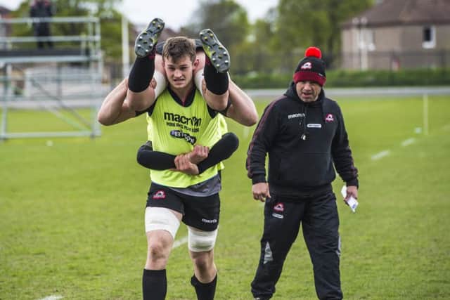 Magnus Bradbury is put through his paces yesterday as Edinburgh train ahead of tomorrows clash with Munster. Picture: SNS