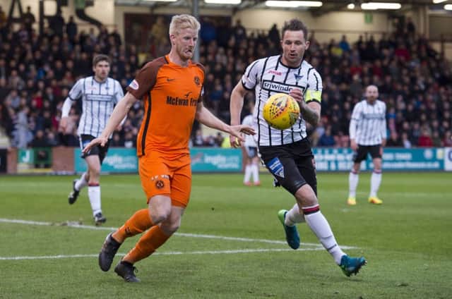 Dunfermline captain Callum Morris, right, in action against Dundee Uniteds Thomas Mikkelsen during the goalless first leg of their play-off quarter-final on Tuesday. Picture: SNS