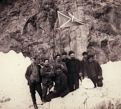 William S Bruce with the crew of the Scotia, flying the expedition saltire - part of the recently discovered collection of pictures taken during the William Speirs Bruce Scottish National Antarctic Expedition, and their vessel "Scotia".  Pictures now in Royal Scottish Georgraphical Society archive.