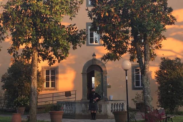 A piper from Pisa plays in Barga on a warm Spring night.
