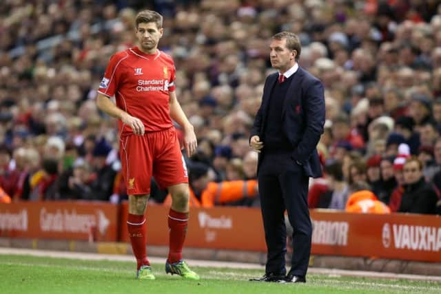 Brendan Rodgers and Steven Gerrard pictured in 2014 when they were manager and captain, respectively, of Liverpool. Picture: Peter Byrne/PA Wire