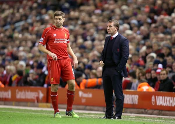 Brendan Rodgers and Steven Gerrard pictured in 2014 when they were manager and captain, respectively, of Liverpool. Picture: Peter Byrne/PA Wire