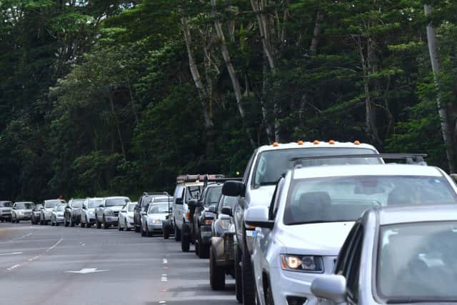 A line of vechicles head for the intersection of Pahoa and Kapoho Roads as evacuees are allowed to return to their Leilani Estates homes to gather belongings and exit. Picture: Getty