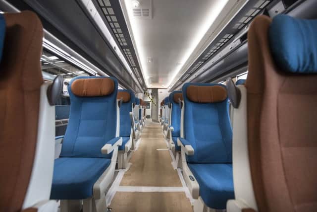 Seated passengers will have individual reading lights and overhead lockable storage. Picture: John Devlin