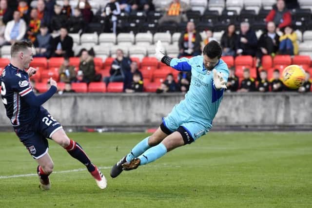 Billy Mckay fires Ross Countys equaliser past Partick goalkeeper Tomas Cerny to keep his sides slim survival hopes alive. Picture: SNs.