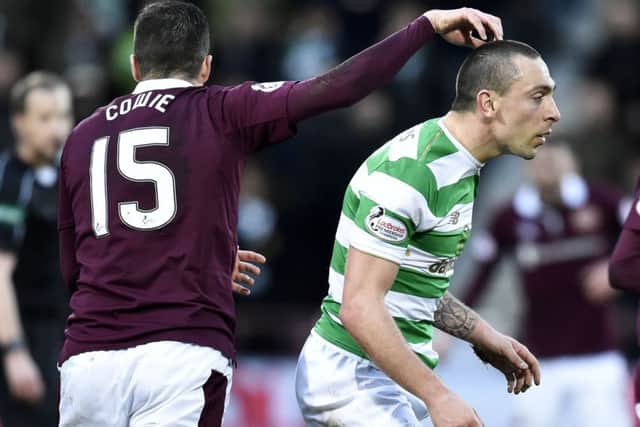 Up to scratch: Don Cowie gets playful with a less than happy Scott Brown during Hearts 4-0 victory over Celtic at Tynecastle in December. Photograph: Rob Casey/SNS