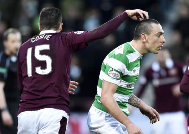 Up to scratch: Don Cowie gets playful with a less than happy Scott Brown during Hearts 4-0 victory over Celtic at Tynecastle in December. Photograph: Rob Casey/SNS