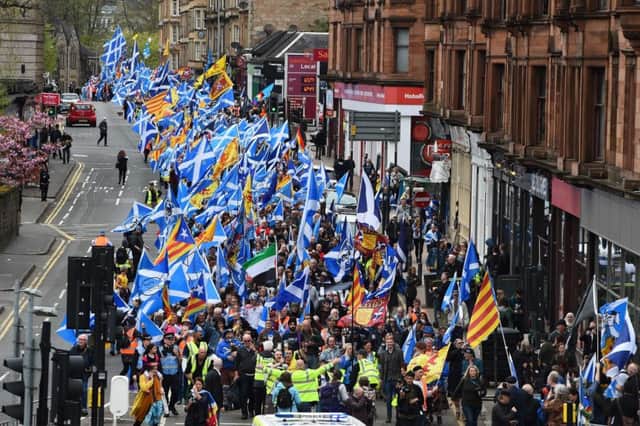 Thousands of demonstrators carry Saltire flags, the national flag of Scotland, as they march in support of Scottish independence through the streets of Glasgow. Picture; Getty