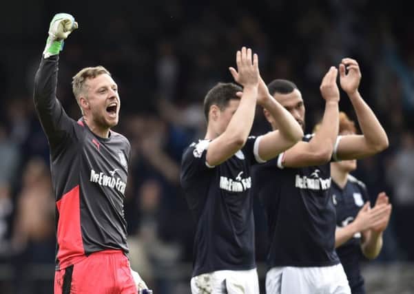 Dundee goalkeeper Elliott Parish leads the celebrations at full time. Picture: SNS Group