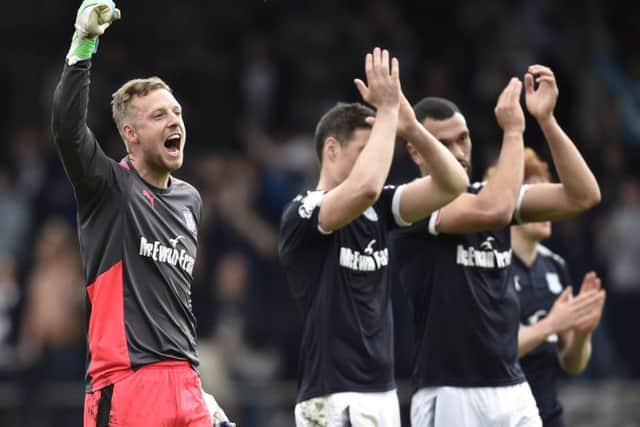 Dundee goalkeeper Elliott Parish leads the celebrations at full time. Picture: SNS Group