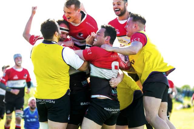 Hawks celebrate after Sam Yawayawas try.  Photograph: Graham Stuart