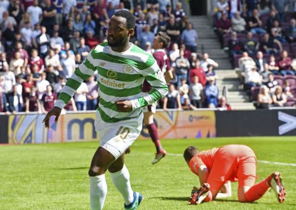 Moussa Dembele celebrates his goal after beating Jon McLaughlin from inside the penalty box. Picture: SNS