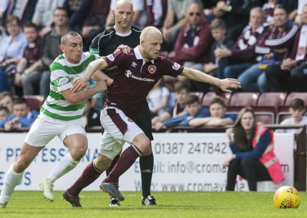 Scott Brown and Steven Naismith battle for possession. Picture: SNS