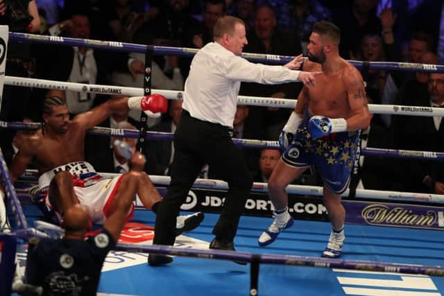 Tony Bellew is sent to a neutral corner after knocking down David Haye on his way to a victory in five rounds at the O2 Arena in London on Saturday evening. Picture: Getty.