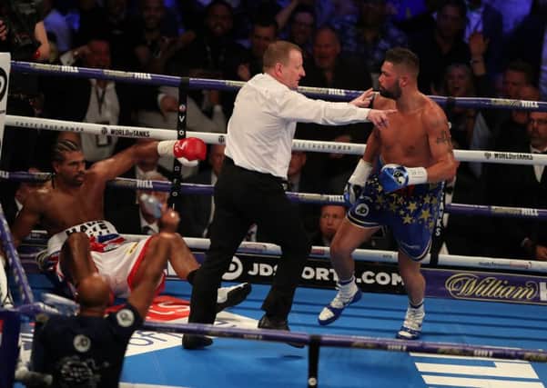 Tony Bellew is sent to a neutral corner after knocking down David Haye on his way to a victory in five rounds at the O2 Arena in London on Saturday evening. Picture: Getty.