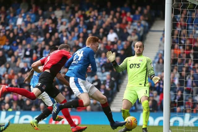 David Bates scores the decisive goal against Kilmarnock at Ibrox on Saturday. Picture: PA.