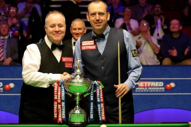John Higgins, left, and Mark Williams pose with the trophy before the start of the World Championship final at The Crucible. Picture: PA