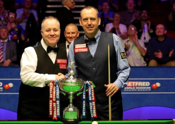 John Higgins, left, and Mark Williams pose with the trophy before the start of the World Championship final at The Crucible. Picture: PA