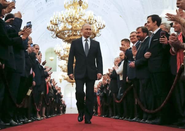 Vladimir Putin enters to take the oath during his inauguration ceremony. Picture: AP Photo/Alexander Zemlianichenko