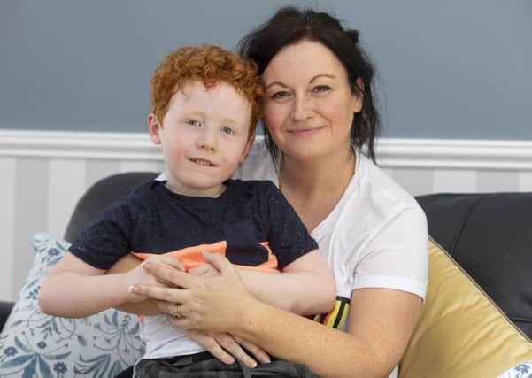 Five-year-old Patrick and his mother Theresa Dolan. Picture: SWNS