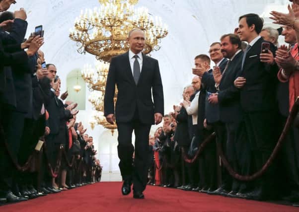 Vladimir Putin enters to take the oath during his inauguration ceremony as Russia's new president in the Grand Kremlin Palace in Moscow (Picture: AP)