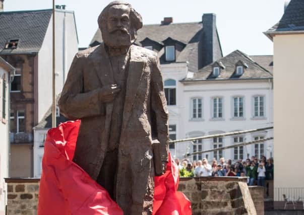 A statue of Karl Marx is unveiled in his birthplace of Trier in Germany (Picture: Getty)