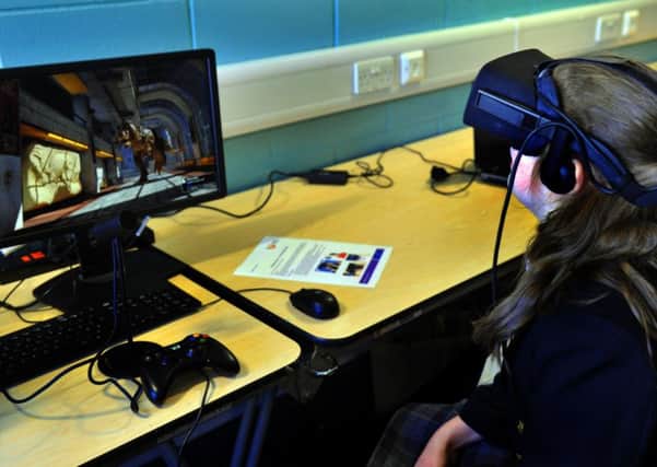 051017    A  schoolgirl  at Raf Leeming  where they were attending a  conference aimed at girls working in  STEM  Science,  Technology , Engineering and Maths, using  Oculus RFT VR  system  brought  by Teeside University to the event.