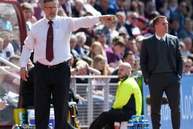 Hearts manager Craig Levein makes a point during Sundays clash at Tynecastle as Celtic boss Brendan Rodgers looks on. Picture: SNS.