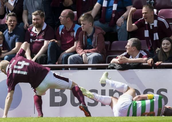 Hearts' Steven Naismith makes a challenge on Scott Brown during the recent match at Tynecastle. Picture: SNS