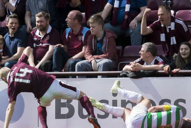 Hearts' Steven Naismith makes a challenge on Scott Brown during the recent match at Tynecastle. Picture: SNS