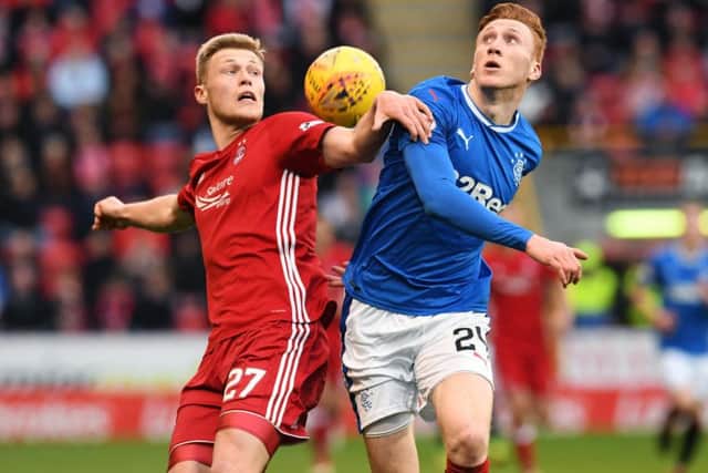 Aberdeen's Sam Cosgrove jousts with Rangers' David Bates during a hard fought draw at Pittodrie. Picture: Craig Foy/SNS