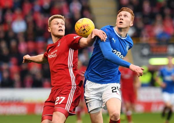 Aberdeen's Sam Cosgrove jousts with Rangers' David Bates during a hard fought draw at Pittodrie. Picture: Craig Foy/SNS