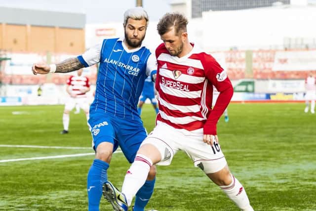 Richard Foster and David Templeton battle for possession. Picture: SNS