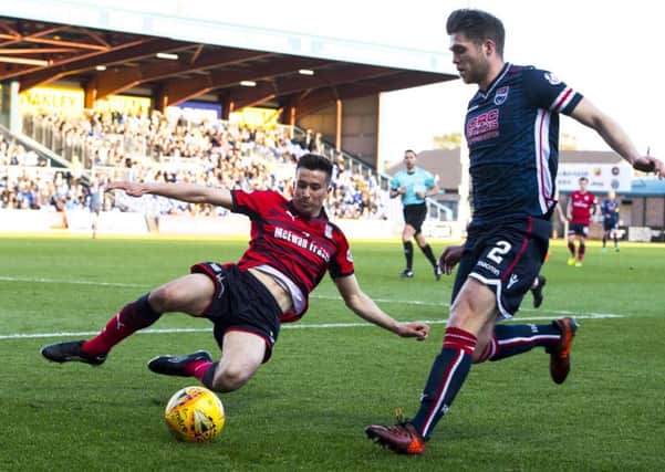 Cammy Kerr looks to dispossess County defender Marcus Fraser. Picture: SNS