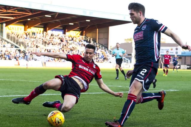 Cammy Kerr looks to dispossess County defender Marcus Fraser. Picture: SNS