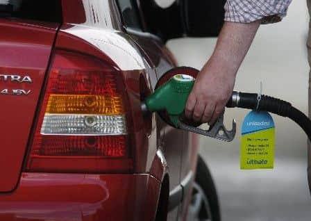 A driver fills up with petrol. Picture: TSPL