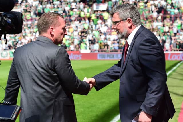 Brendan Rodgers and Craig Levein shake hands prior to kick-off. Picture: SNS