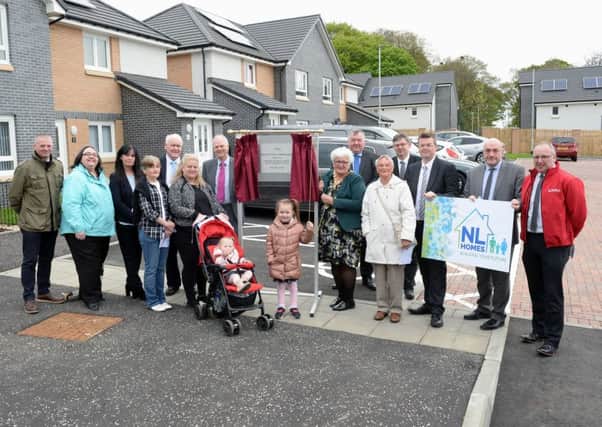 North Lanarkshire provost Jean Jones unveils the plaque at the official opening of Nursery Court in Kildrum