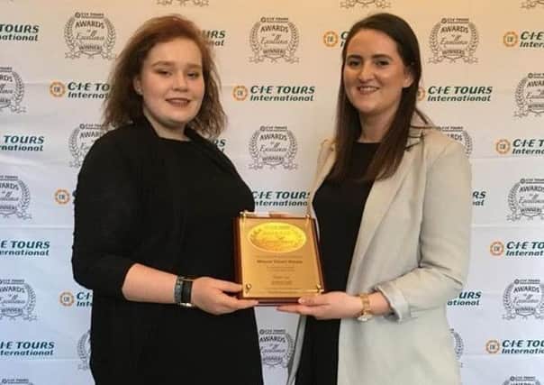 Kathleen Martin and Stephanie Jenkins collect the CIE Award of Excellence on behalf of the Mount Stuart team.