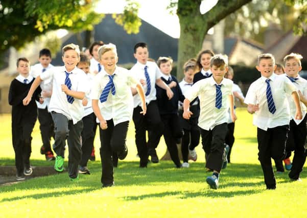 Researchers studying nearly 400 pupils found those doing The Daily Mile ran on average 39.1 metres more on a bleep test shuttle run than a control school. Picture: TSPL