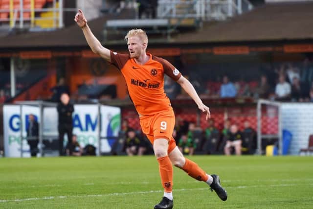 Thomas Mikkelsen, celebrating his goal in Mondays first leg, is convinced Dundee United are a better team than Livingston. Picture: SNS.