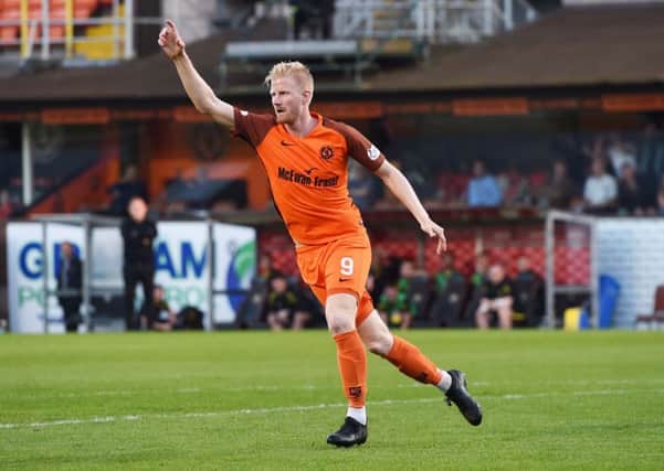 Thomas Mikkelsen, celebrating his goal in Mondays first leg, is convinced Dundee United are a better team than Livingston. Picture: SNS.