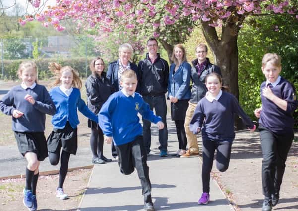 Pupils from St Ninian's Primary in Stirling take part in the Daily Mile with researchers who studied the practice (Picture: Elaine Livingstone)