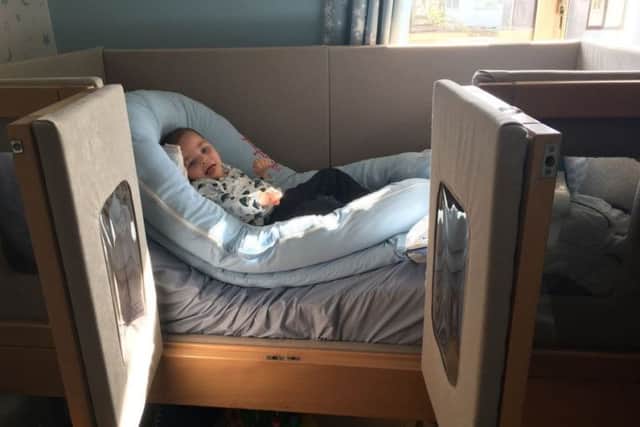 Daniel Vernel, five, in his specialist bed.