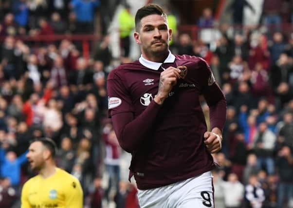 Hearts' Kyle Lafferty scored his 19th goal of the season against Hibs but later injured his shoulder. Picture: Craig Williamson/SNS