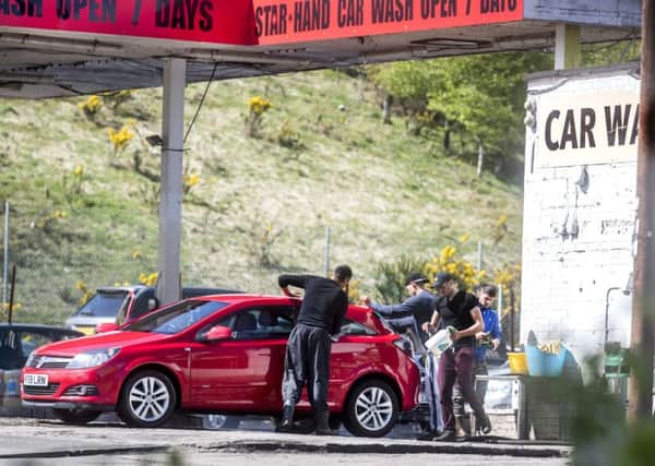 Licensing car washes would ensure they paid tax and did not exploit workers. Picture: John Devlin