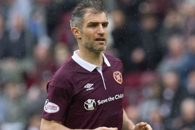 Aaron Hughes has been offered a new contract at Hearts but he's still to decide whether he wants to continue his playing career at all. Picture: Craig Foy/SNS