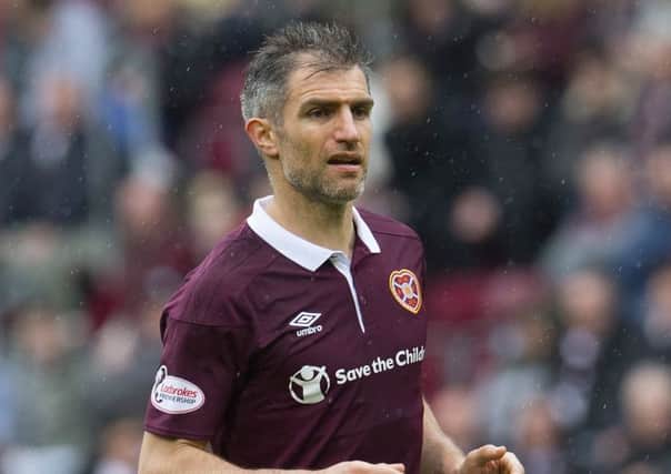Aaron Hughes has been offered a new contract at Hearts but he's still to decide whether he wants to continue his playing career at all. Picture: Craig Foy/SNS